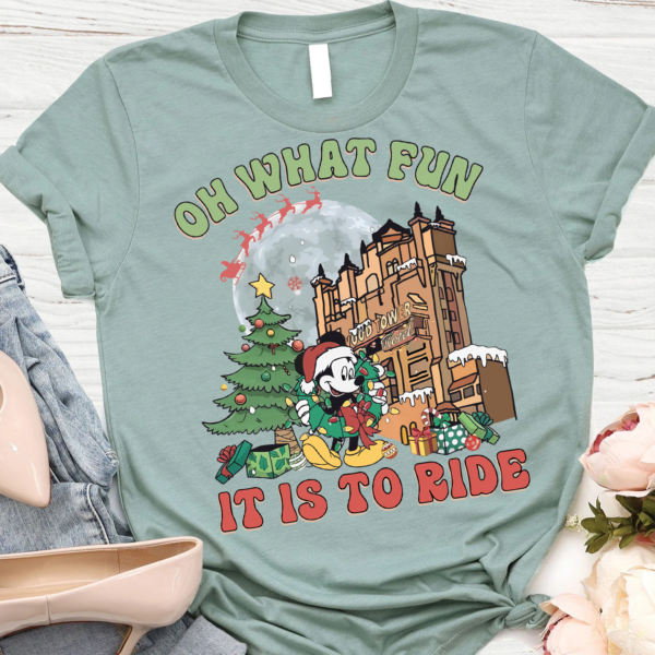 Person wearing Mickey's 'Oh What Fun It Is To Ride' Christmas shirt during a 2024 Xmas party at Disneyworld Hollywood Studios