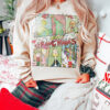 Charming vintage Grinch Christmas sweatshirt, perfect for festive gatherings and cozy winter wear.