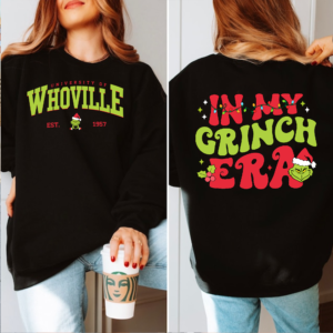 Person wearing a retro Whoville University crewneck sweatshirt, ideal for Christmas gatherings and winter outings.