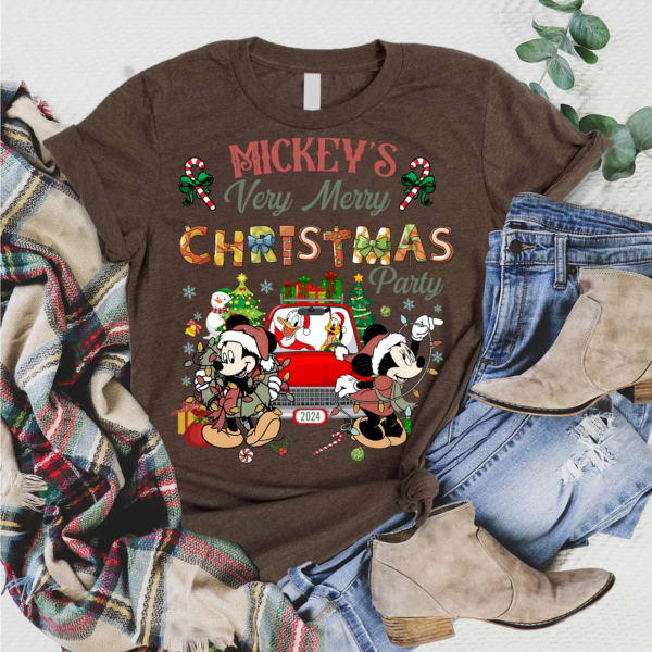 Disney fan wearing a Vintage Mickey's Christmas Party 2024 shirt at Walt Disney World during the holidays.