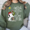 Snoopy hugging a cross with a wreath and Santa hat, accompanied by the text 'I’m a Christian, I’m not perfect, I make mistakes, I mess up, but God’s grace is bigger than my sins